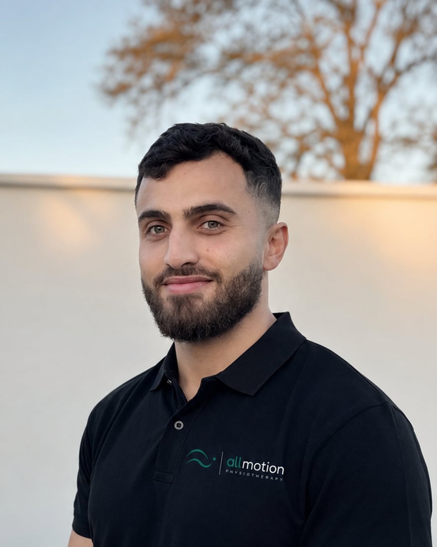 Hasan Farhat, Senior Physiotherapist, in an All Motion Physiotherapy polo